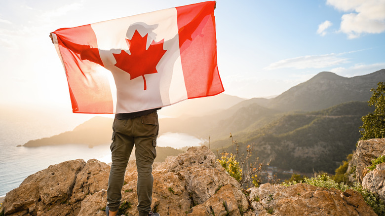 Man holding the Canadian flag