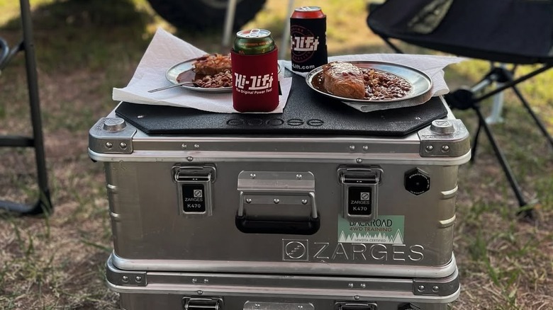 food and drinks sitting on top of Zarges aluminum storage box