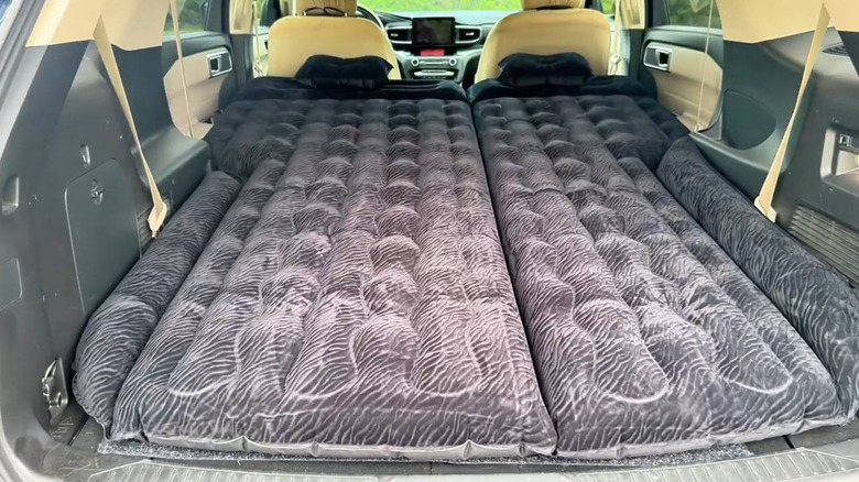 The Umbrauto air mattress in a car.