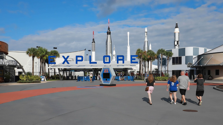 People walking toward the entrance to the Kennedy Space Center
