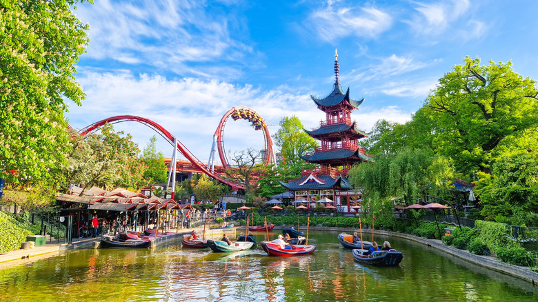 Rides and a lake at Tivoli Gardens amusement park
