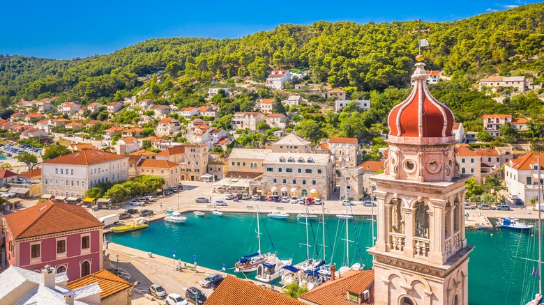 Church bell tower and fishing village of Pucisca on Brac Island