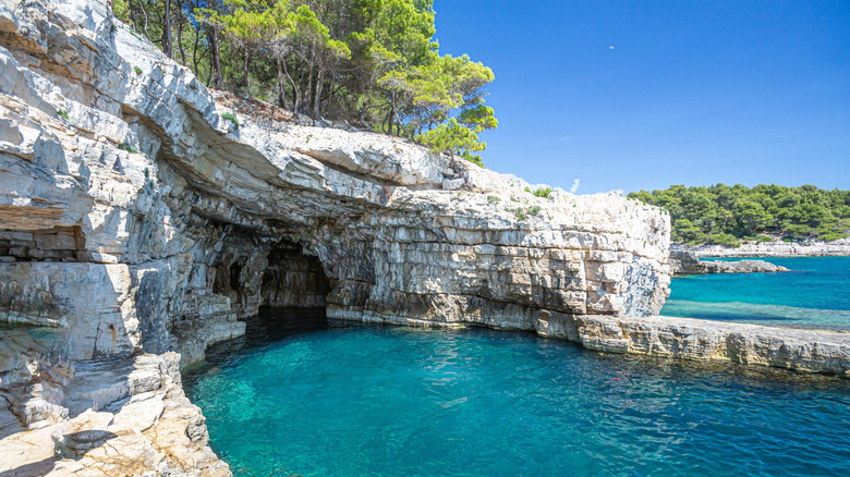 Pula coastline with rocks and cave