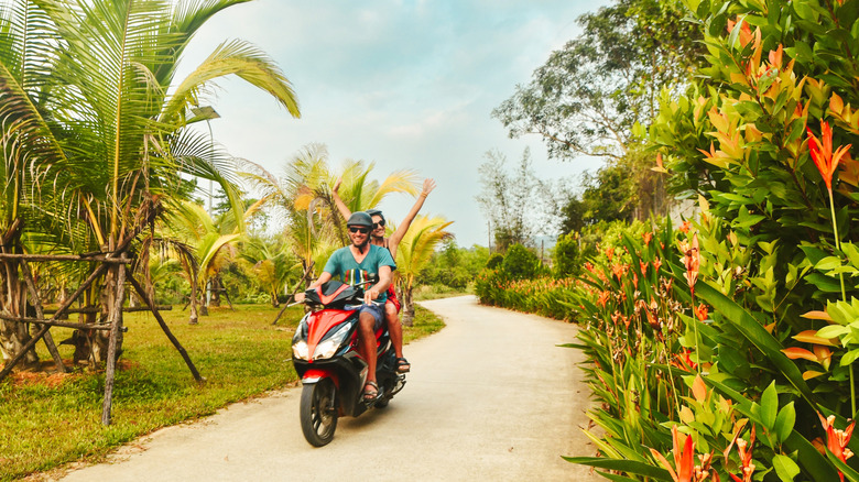 couple on a scooter in Thailand