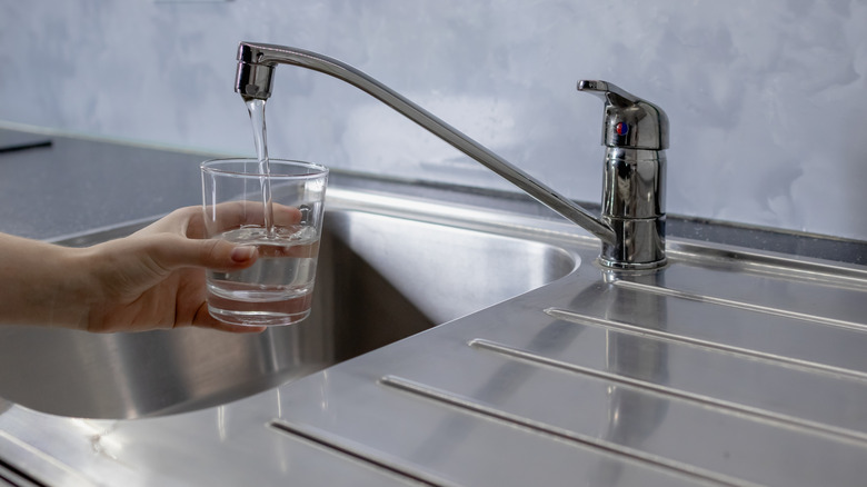 filling glass with tap water