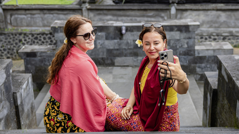 Two tourists taking selfie in Bali