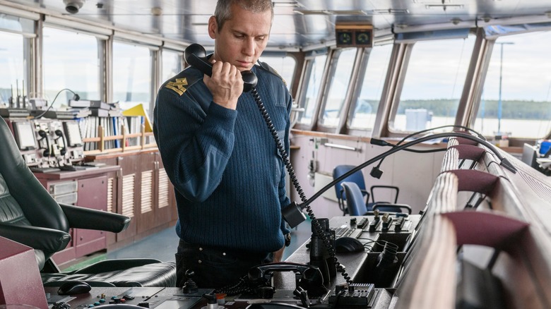Cruise captain speaking into radio