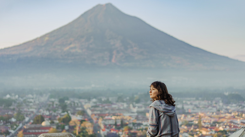 Woman overlooking a Guatemala volcano