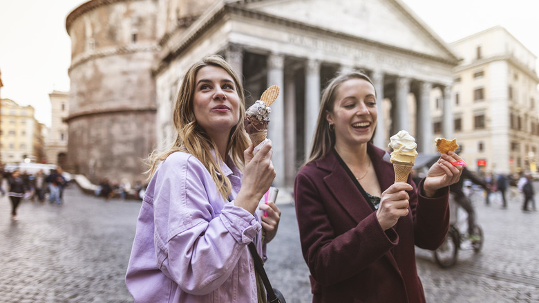 tourist women eating outside pantheon