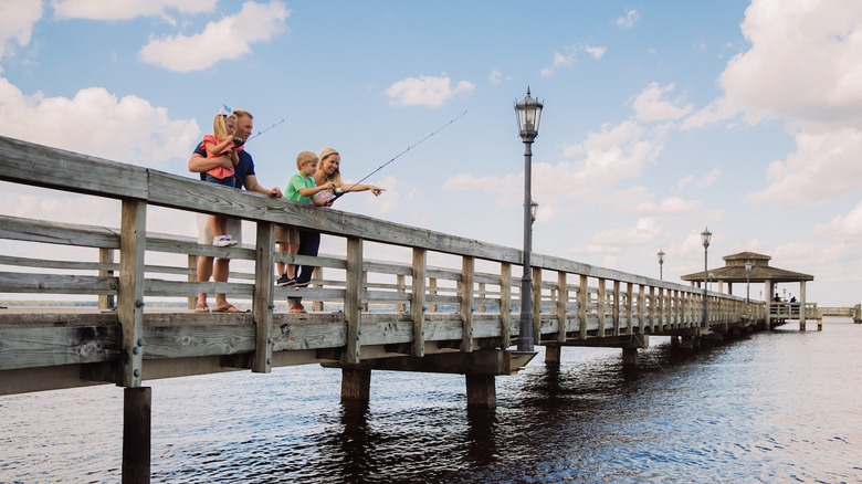 Family fishing on a dock in Clay County, FL