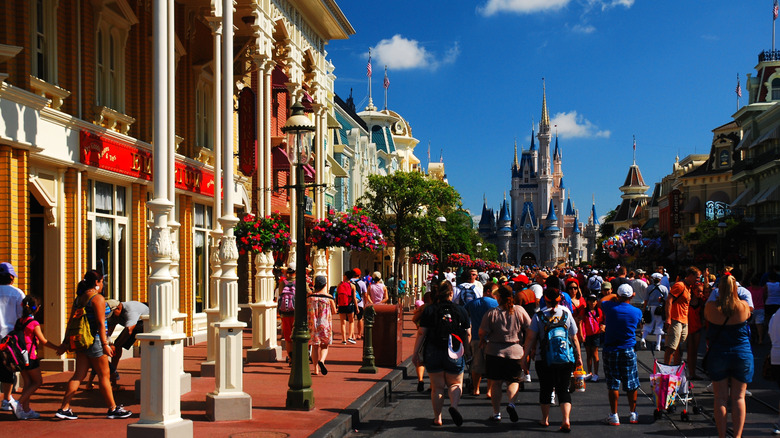 people walking along Main Street USA