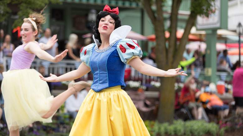 Young woman dressed up as Snow White during a parade