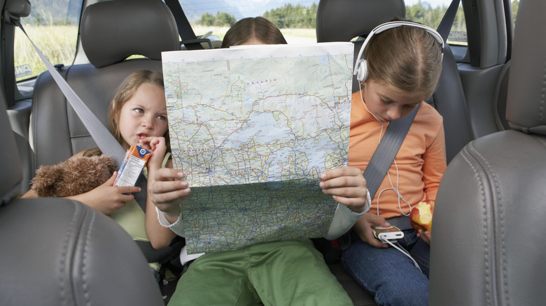 Kids looking at a map