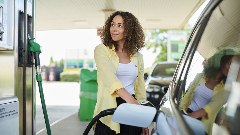 Woman filling up gas