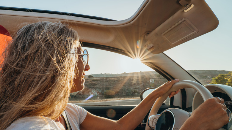 woman driving rental car