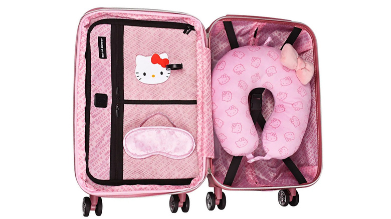 An open Hello Kitty Carry On suitcase in pink