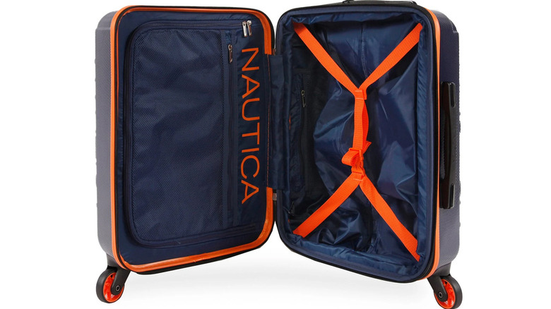 An open Nautica carry-on suitcase with orange straps and accents