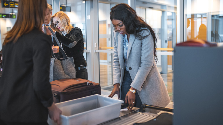 Woman at airport security checkpoint