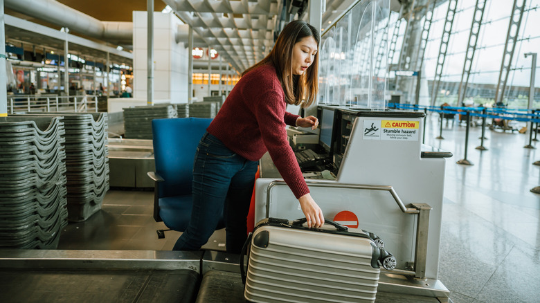 woman checking bags