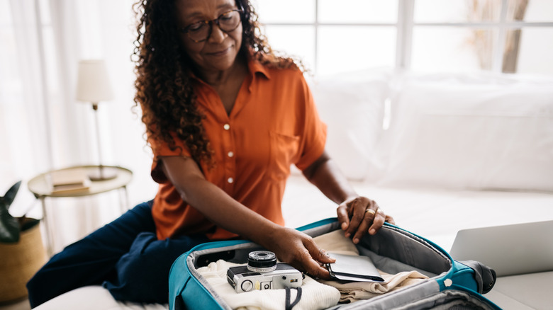 woman packing luggage