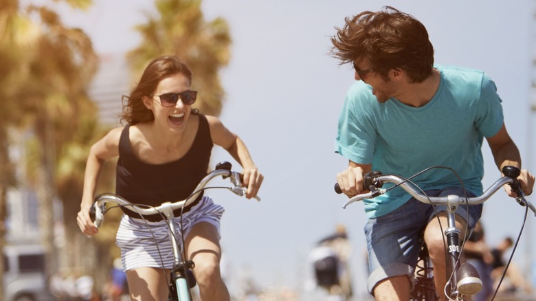 Happy couple on bikes