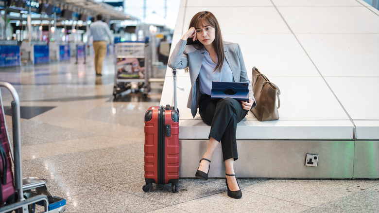 woman waiting at airport 
