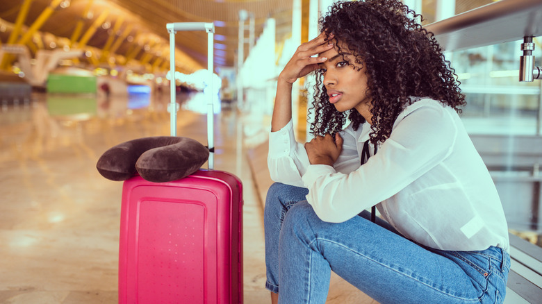 Frustrated woman at airport  