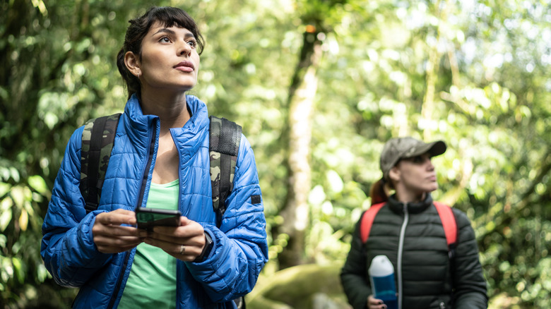 two women hiking in forest