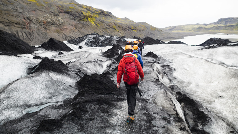 people walking on iceland glacier