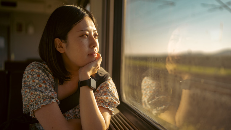 Woman looking out a window 