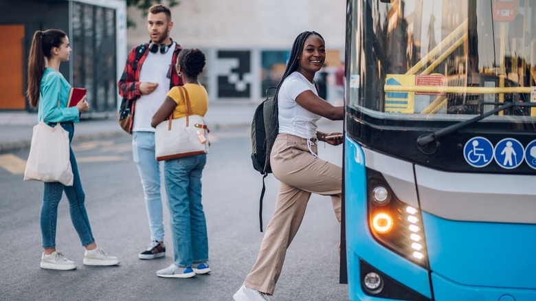 Woman getting on a bus