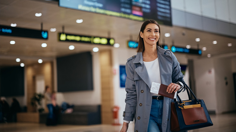 Woman walking through an airport