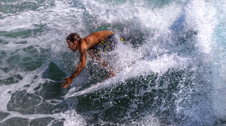 A surfer at Sebastian Inlet State Park, Sebastian takes advantage of Central Florida's well known super spot for surfing.
