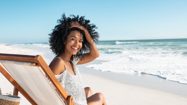 woman smiling on tropical beach