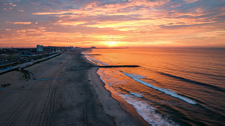 A view of an empty Rockaway Beach at sunrise