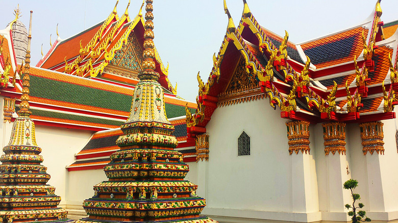 A temple in Thailand with elaborate, colorful roofing