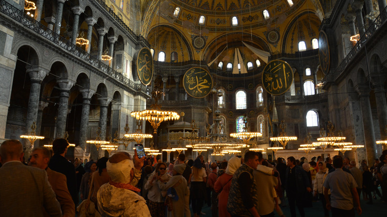 Crowds of tourists inside the Hagia Sophia mosque in Istanbul, Turkey
