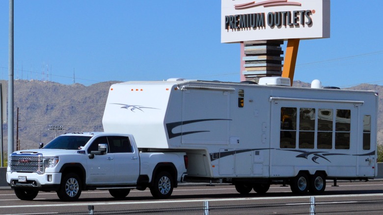 fifth wheel camper heads down road