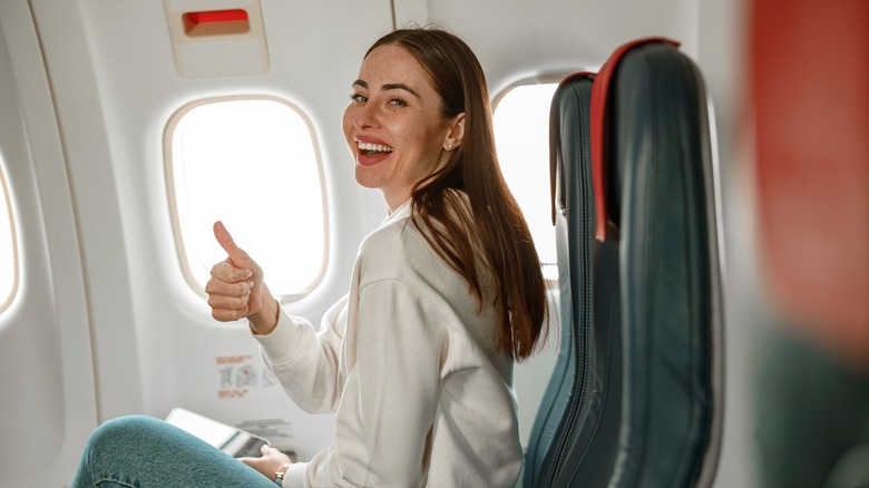 Happy girl on an airplane