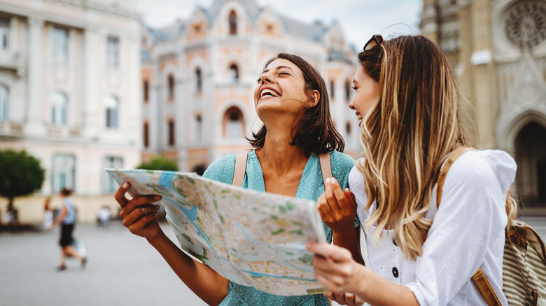 Women traveling with a map 