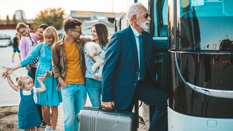 travelers boarding a bus