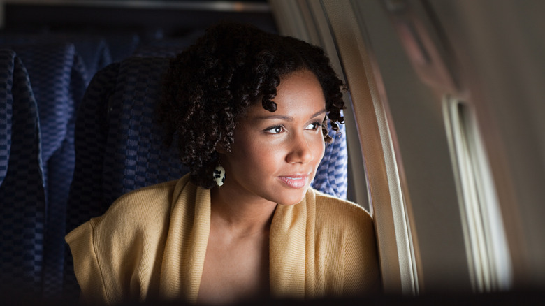 happy woman on plane