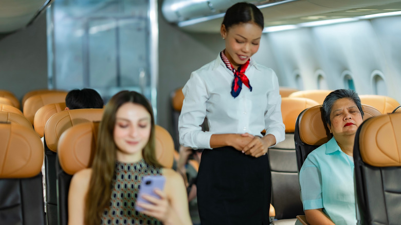 Flight attendant in cabin