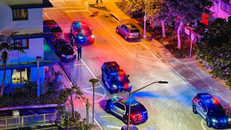 Police officers and cars at a crime scene in Florida