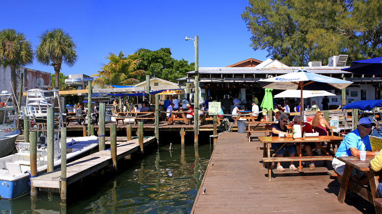 Diners enjoying fresh seafood at Star Fish Company, dock and patio