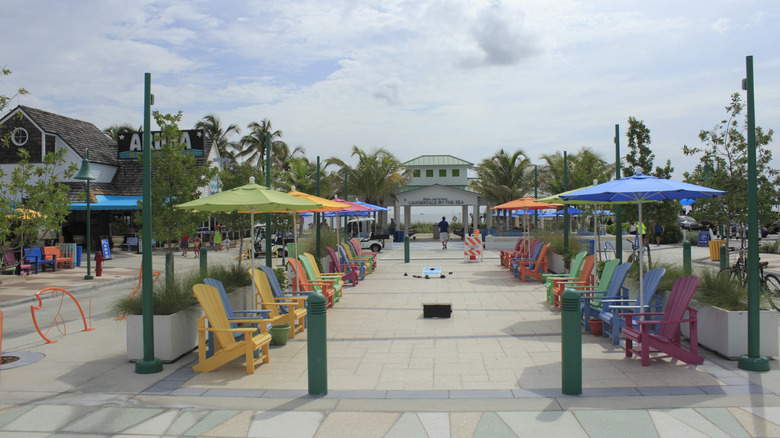 colorful chairs and umbrellas at a sea pavilion