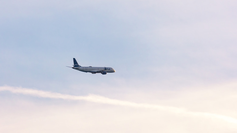 A plane taking off during a sunset