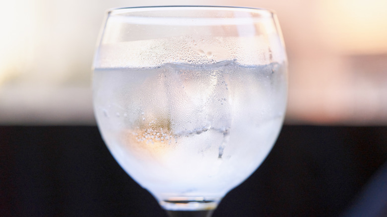 a glass of water with condensation on the sides