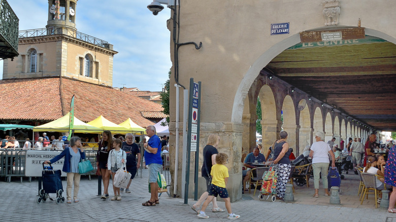people shopping in a medieval covered market