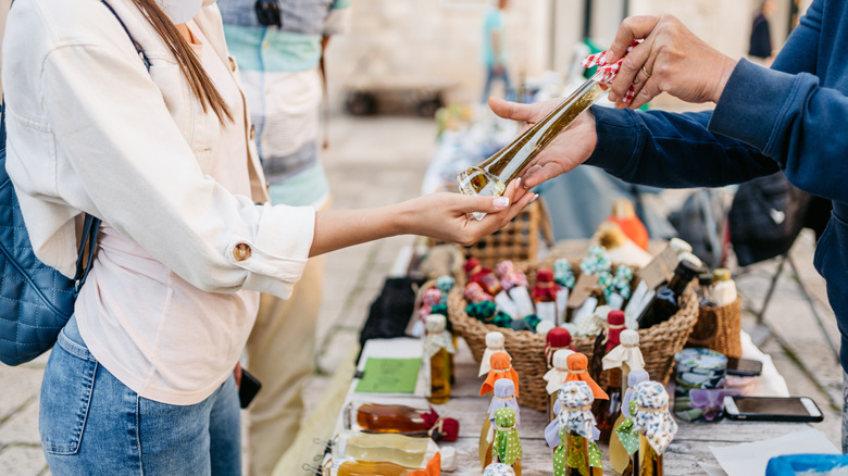tourist visiting market stall